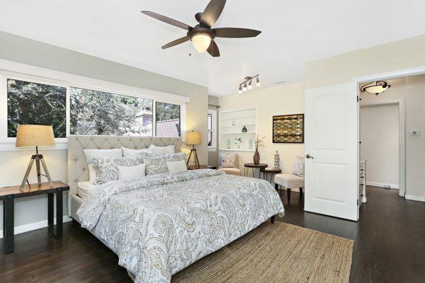 This Master Bedroom in Glendale has views of greenery from every window.