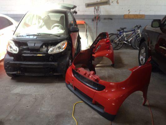 Orange SMART CAR in transformation