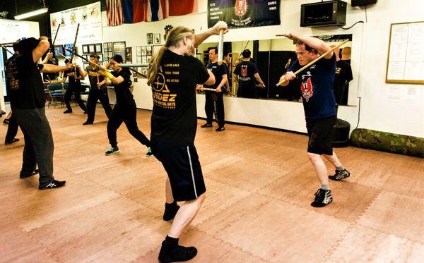 Learn Double Sticks Weapons Training for self-defense in our Kali Escrima group classes @ Tandez Academy.