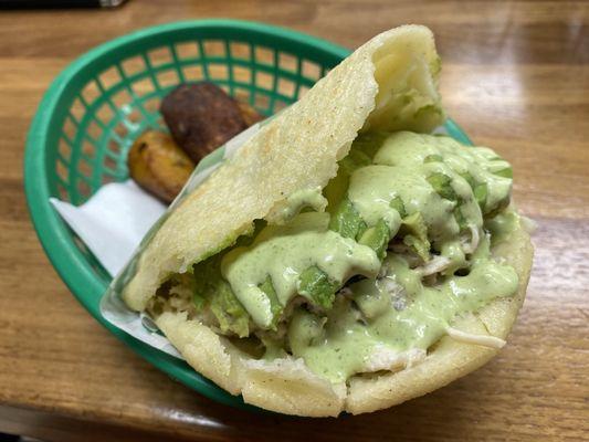 Reina Arepa with lots of green sauce