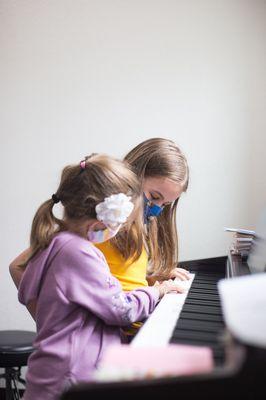 At Backbeat Music academy, students are encouraged to teach each other how to play because social learning helps cement their own knowledge.