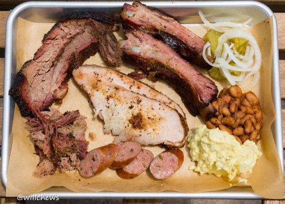 Moist brisket, pork ribs, smoked turkey, pulled pork, jalapeño sausage, onions/pickles, pinto beans, potato salad