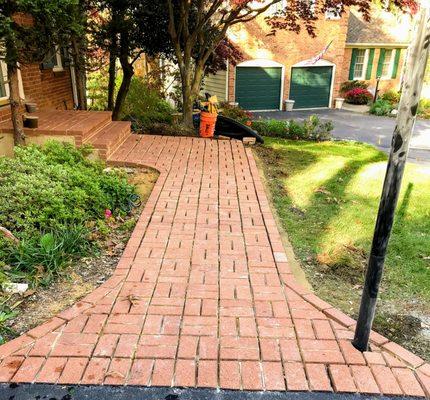 Flagstone pathway with brick border.