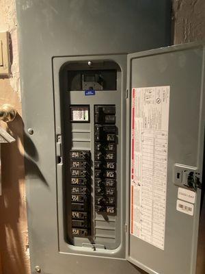 Upgraded house electrical panel (from 100 to 150 amps) with a new 100 amp switch wired around the garage to the new charging station.