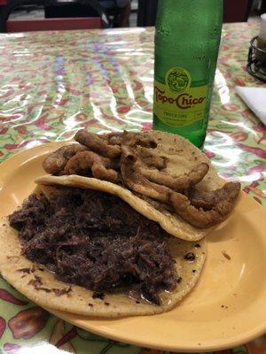 Barbacoa taco on corn & crispy tripas taco on corn.