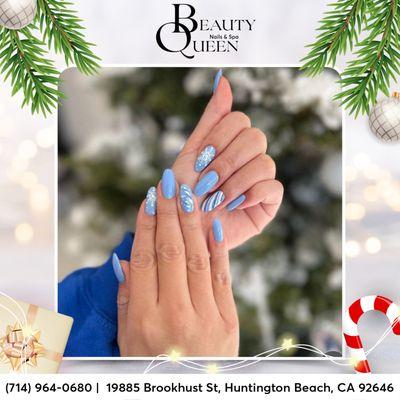 Elevate your festive style with our chic blue nail polish art, adorned with charming snowflakes, for a winter wonderland look this Christmas