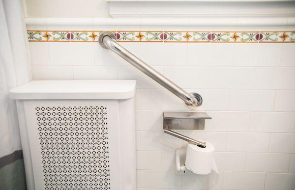 Stainless steel grab bar installation throughout the bathroom