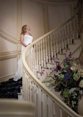 Bride looking up the staircase