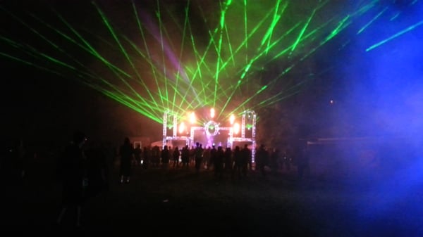 Large outdoor festival stage. We provided staging, truss, lighting, lasers and sound for this massive EDM event.