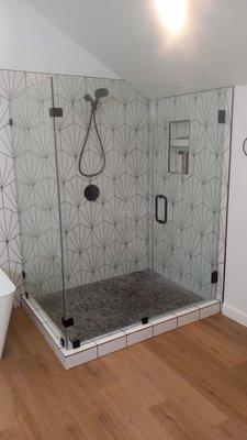 Frameless shower door using 3/8 glass and wall mount hinges and clips.