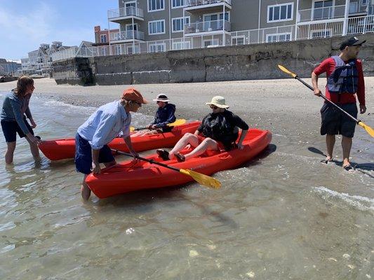 Workers help customers get into the kayak and out into the water safely!