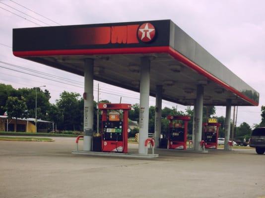 Texaco is in the front of the food store.