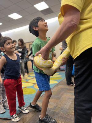 My kids got to experience holding snakes at the library.