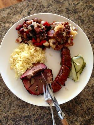 Takeout: lamb with saffron rice, garlic sausage, warm German potato salad & outlaw beans