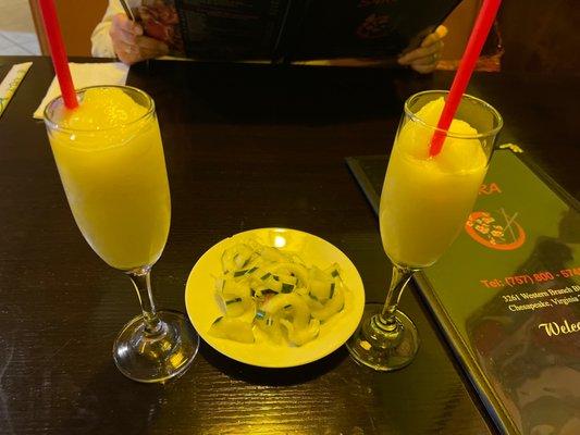 Complimentary Pineapple Smoothie and cucumber salad.