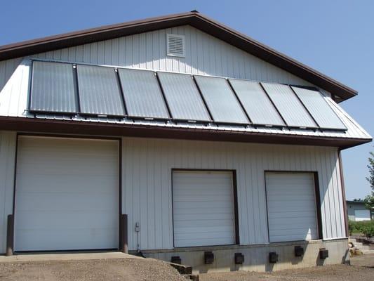 The 8-panel solar thermal (solar hot water) system installed at the Steiner Plumbing, Electric & Heating shop.