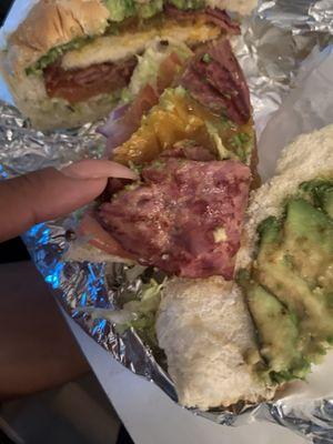 Chicken cutlets avacado American cheese served with a pig ass