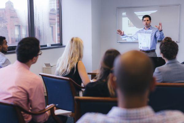 Jobspring team members attending a weekly meeting.