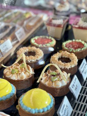 Freshly made key lime tarts, strawberry tarts, lemon blueberry tarts and chocolate peanut butter tarts.