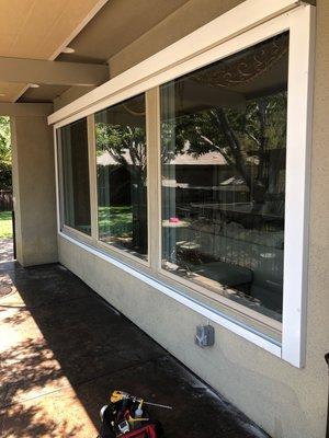 Motorized exterior shade covering a 3 window area. Job complete.