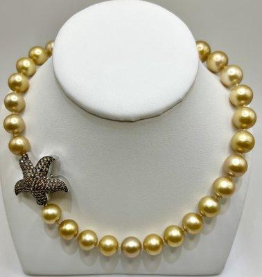 Golden South Sea Pearl necklace with champagne diamond starfish clasp.