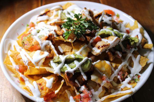 NACHOS:
Crispy tortilla chips toped with fresh Mexican Flavors