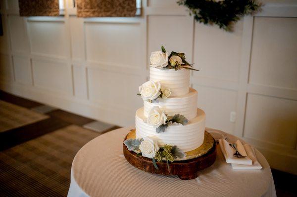 We asked Michael to place a few white roses and greenery on our cake - beautiful and simple!