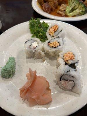 Various sushi rolls--a crab stick/cream cheese, a Kani salad roll and a spicy crab roll.