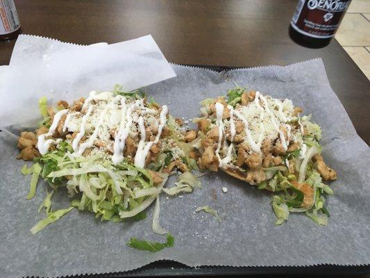 Chicken tostadas with sour cream and cheese