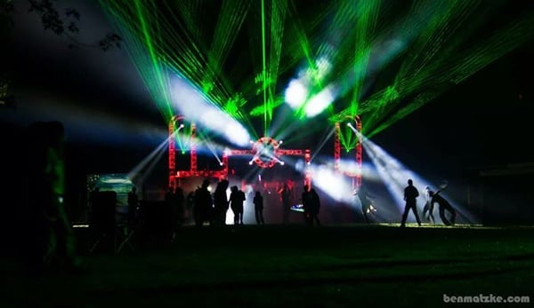 Large outdoor festival stage. We provided staging, truss, lighting, lasers and sound for this massive EDM event.