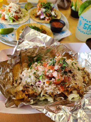 Salvador Fries, yuca fries with shredded chicken, cabbage, pico, cotija.