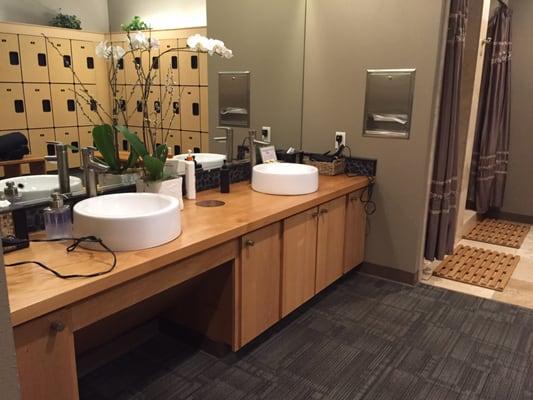 Hands down the BEST yoga studio bathroom/shower design I've ever seen!!!  Blow dryers, lovely showers, lockers, roomy and lush.