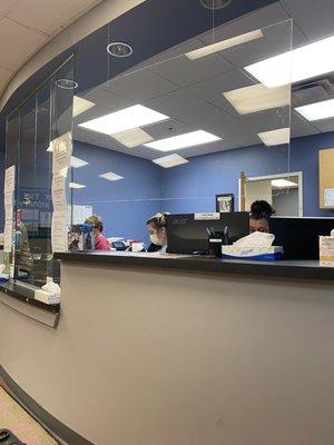 Reception desk and spacious waiting area.