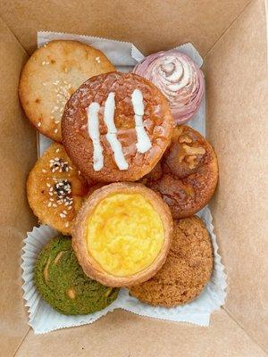 Top: Guava mochi, Portugese egg tart Bottom: Cassava muffin, taro ball, mochi, banana walnut mochi, matcha choux, black sesame choux