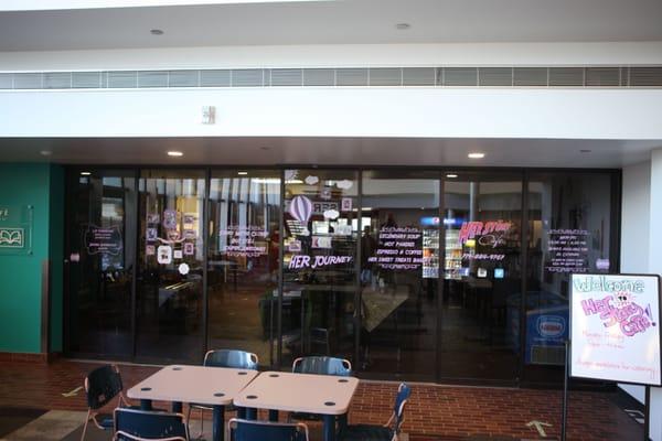 Window graphics for Her Story Cafe in 21c Library.