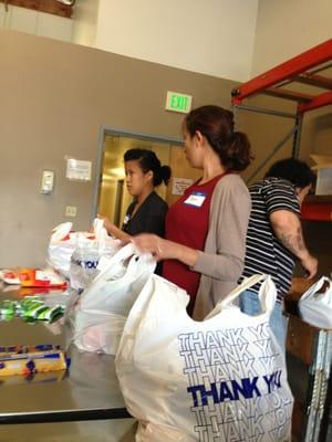 Packing family meals for the holidays.  Great way to give back.