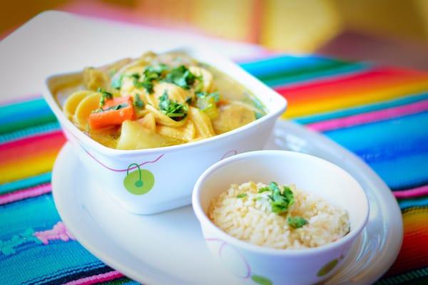 Chicken soup with side of rice