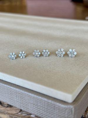 Stunning diamond cluster stud earrings in a variety of sizes.