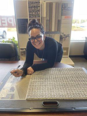 Owner, Stacy McBirney working with me on a large area rug and runners for my new home to be. A Five Star Experience. Julie A