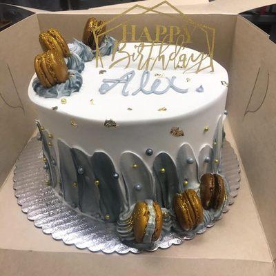 Custom birthday cake with gold macarons