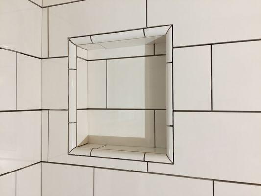 Pre-grout installation. Just to show attention to detail is all important. Notice the tile pattern carrying through the niche.