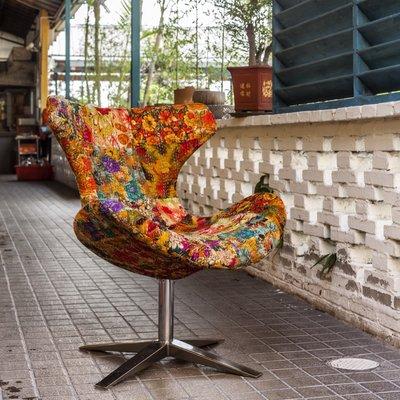 "Capri" mid-century model chair unholstered in colorful vintage Indian kantha fabric.