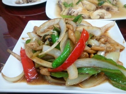 Goose intestines with onions, red peppers, and spicy green peppers in black bean sauce.