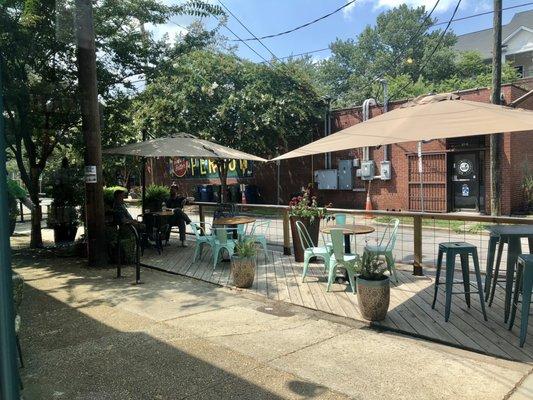 Seating along street side now, in front of the shop.