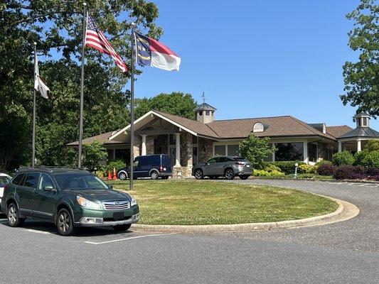 this is the club house with the 3 flags in front