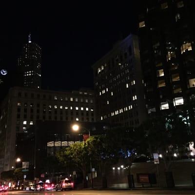 The historic Bank of America building in the San Francisco Financial District lit up at night.