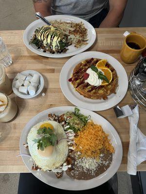 Mole chilaquiles, signature GF waffle, and skirt steak eggs Benedict