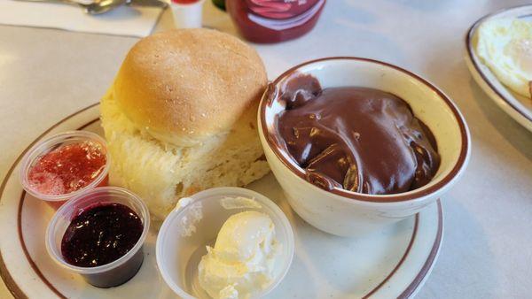 This is a biscuit with chocolate gravy. This is one of the selection for the two egg breakfast. Gravy is like a warm thick chocolate pudding