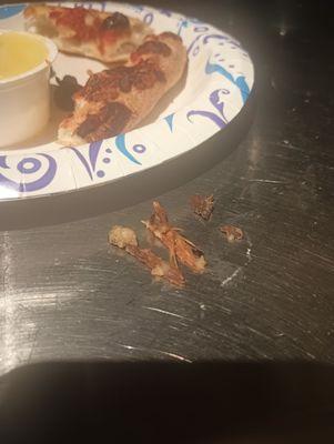 Those are actual pieces of wood I pulled out of my mouth while eating their pizza.