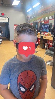 1 on the sides, little fade, scissors on top. The perfect hair cut for his head shape and exactly what we wanted. Thanks AJ.